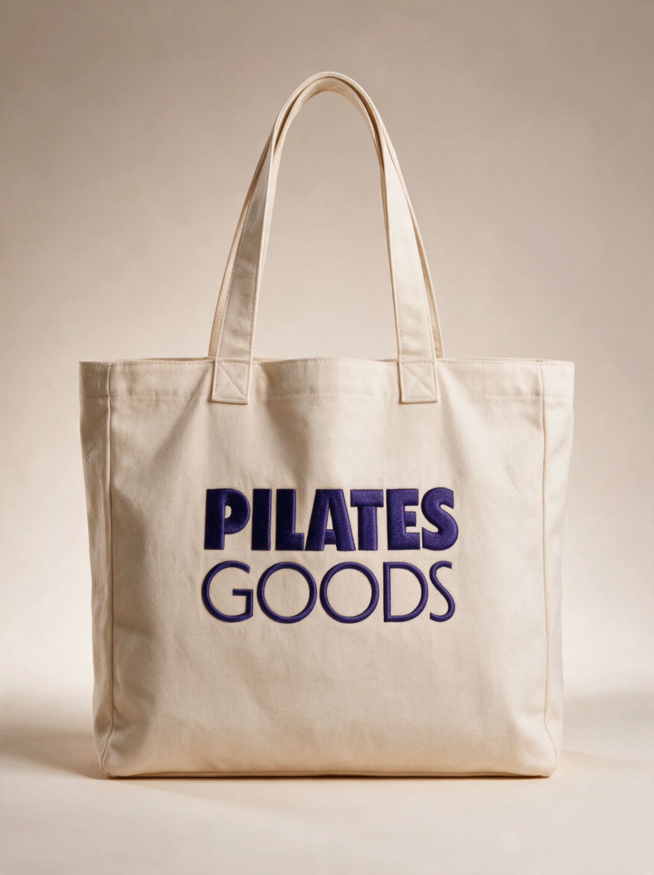 Custom branded Pilates studio tote bag in natural canvas with Pilates Goods logo, available in 20+ colors