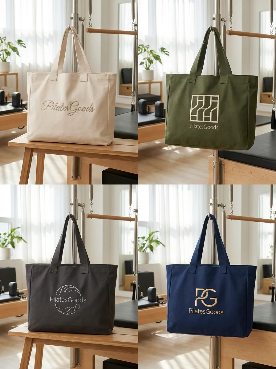 Custom Pilates studio tote bag shown in natural canvas, olive green, charcoal grey and navy blue with embroidered studio logos
