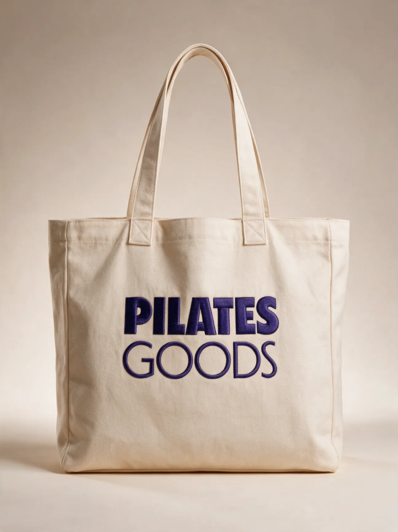 Custom branded Pilates studio tote bag in natural canvas with Pilates Goods logo, available in 20+ colors