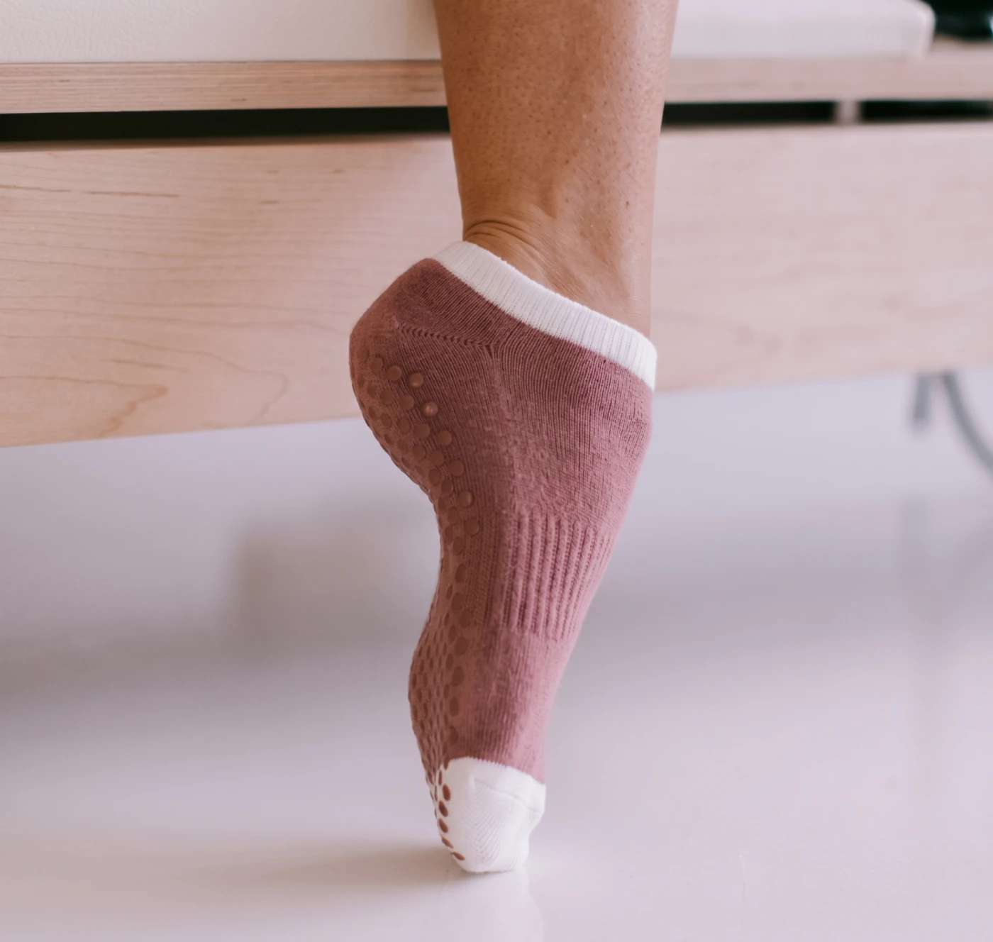 Custom low-rise Pilates grip socks with studio logo and anti-slip sole