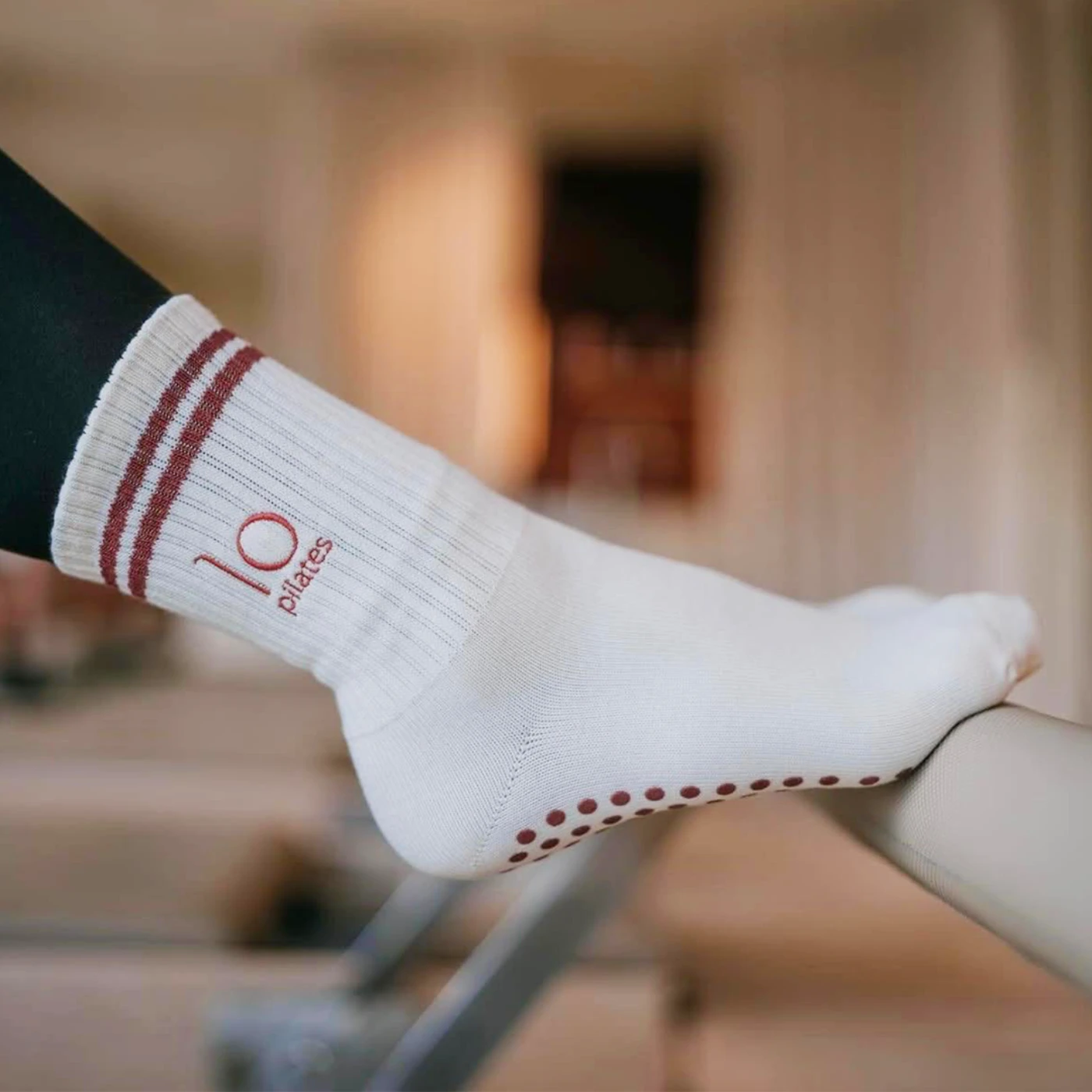 Custom mid-rise Pilates grip socks for reformer sessions with branded logo